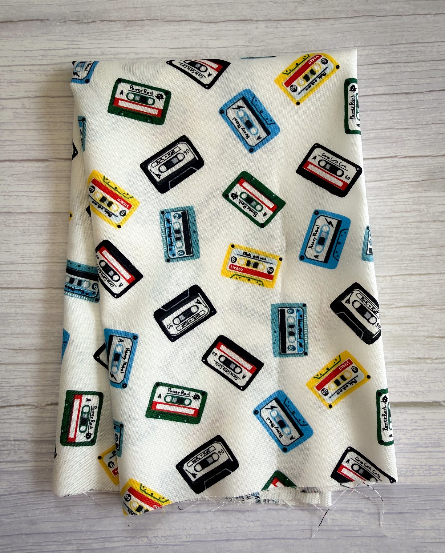 Fabric with cassette tape pattern on a wooden surface