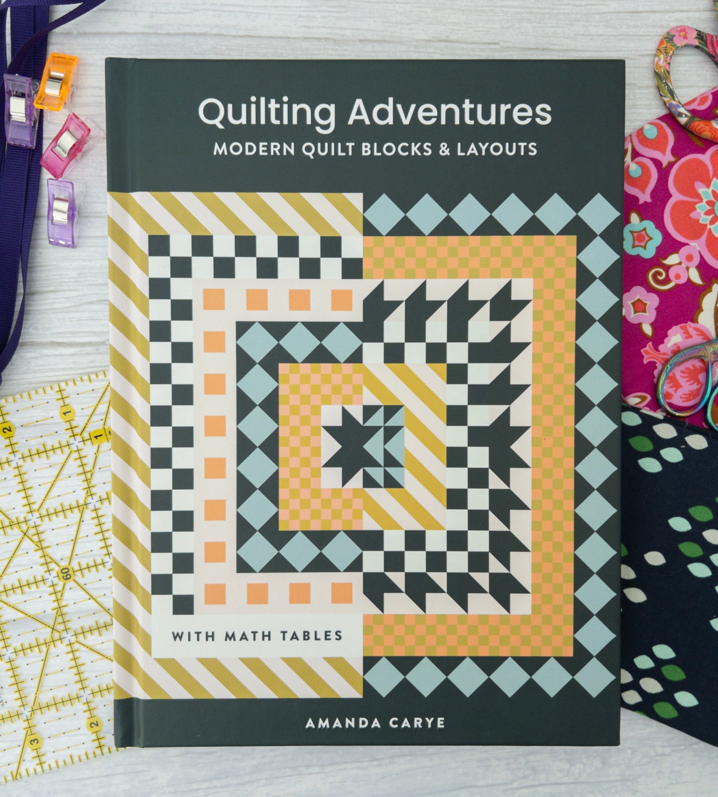 Cover of book showing colorful quilt pattern in geometric shapes