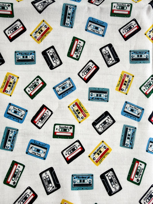 Pattern of colorful cassette tapes on a white background