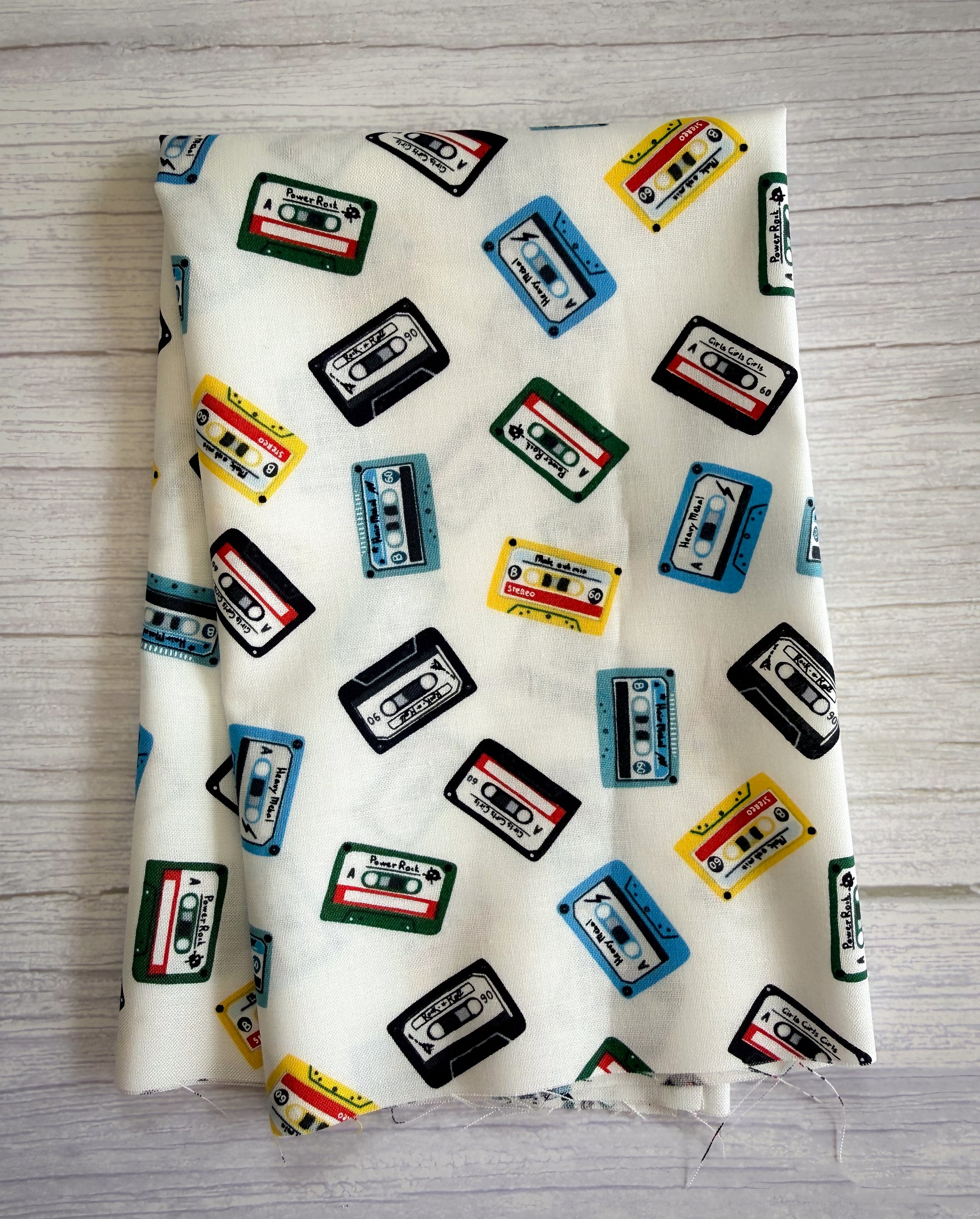 Fabric with cassette tape pattern on a wooden surface